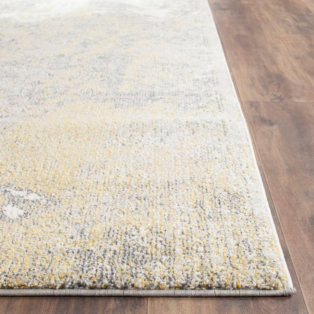 Ivory and Gray Abstract 9' x 12' Synthetic Area Rug
