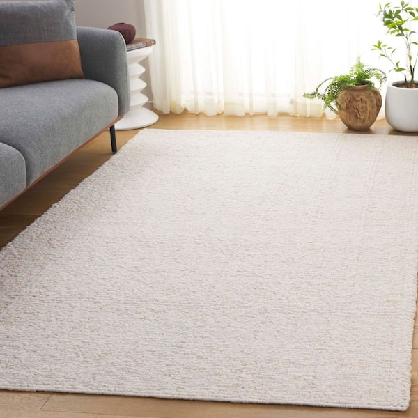 Manhattan 9 ft. x 12 ft. Ivory Modern Solid Color Area Rug