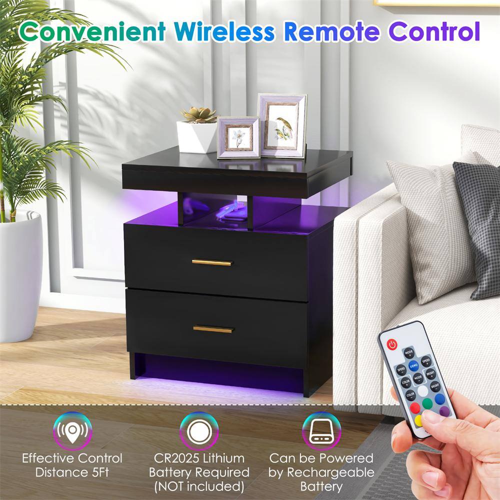 Hand holding a remote control for the LED nightstand.