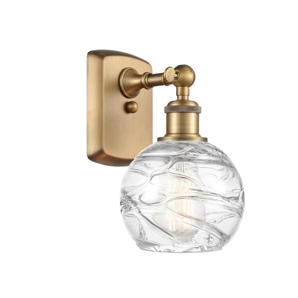 Innovations Athens Deco Swirl 1-Light Brushed Brass Wall Sconce with Clear Deco Swirl Glass Shade