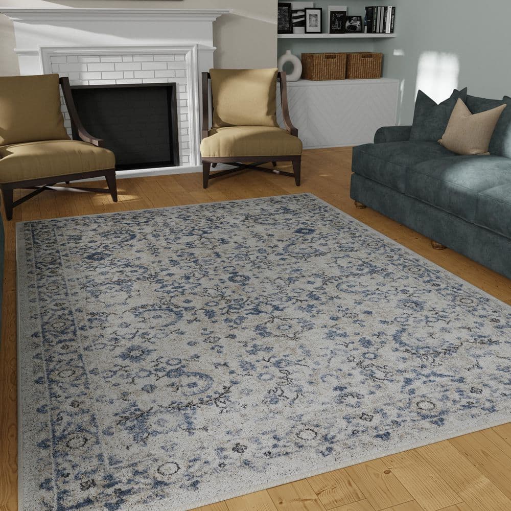 Cream and Blue Floral Border 6' x 9' Synthetic Area Rug