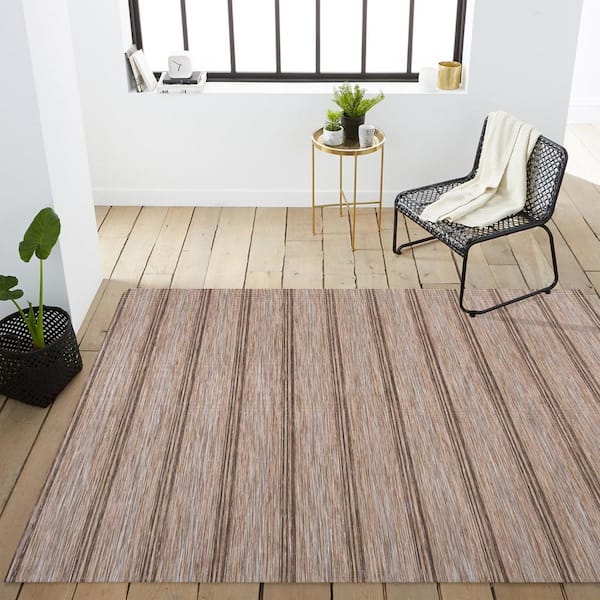 https://images.thdstatic.com/productImages/b76c28b2-6145-4616-8f21-626c2803e693/svn/brown-natural-jonathan-y-outdoor-rugs-tsn101a-9-a0_600.jpg