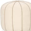 Beige round accent ottoman shown on a plain background.