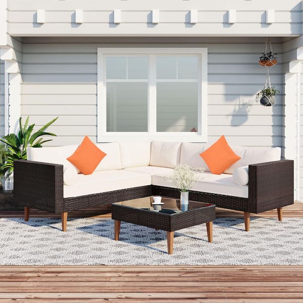 Unbranded 4-Piece Wicker Outdoor Patio Furniture Sectional Set with Colorful Pillows, Coffee Table, and Beige Cushions
