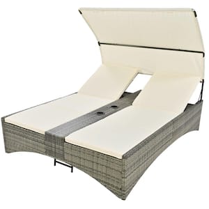 Green Wicker Outdoor Day Bed with Cream Cushions and Shelter Roof