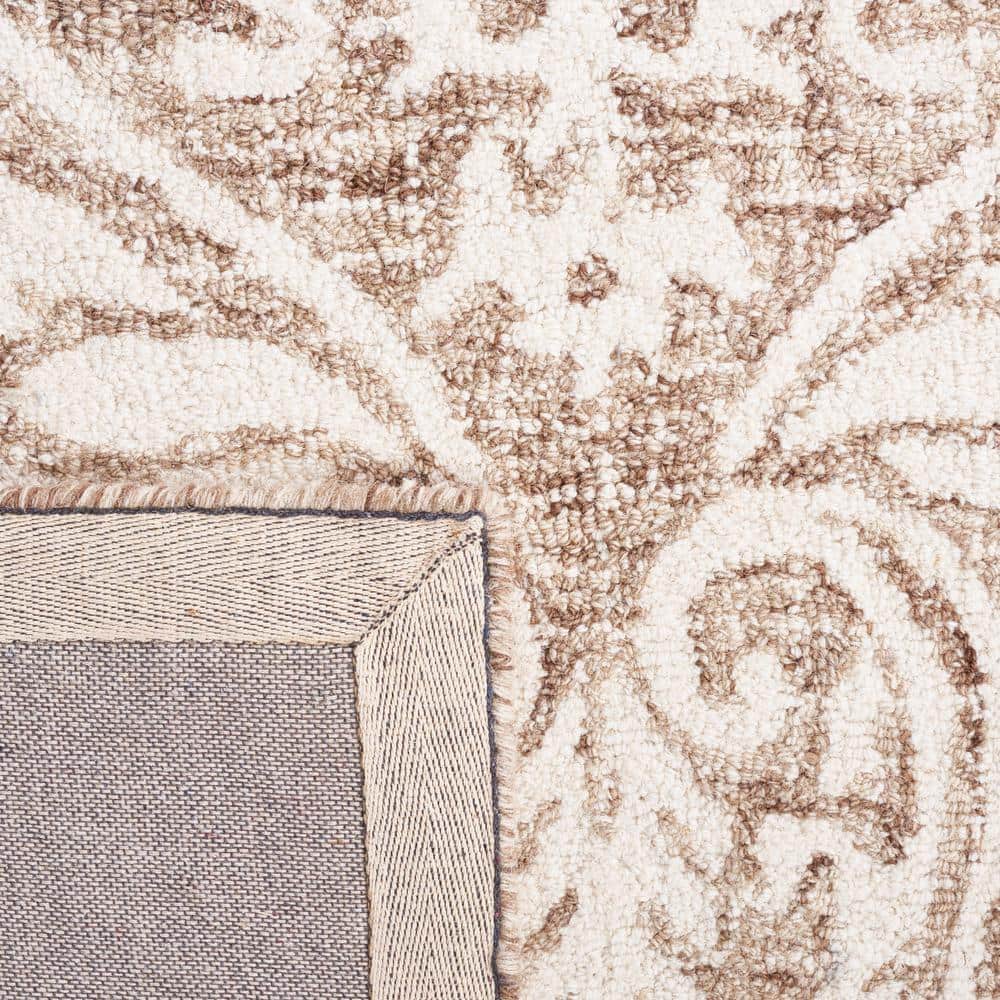 Ivory and Beige Abstract Wool 6' x 9' Handmade Tufted Rug