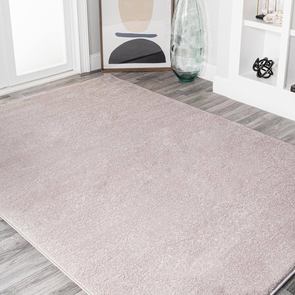 Beige Solid Synthetic Low-Pile Reversible Area Rug