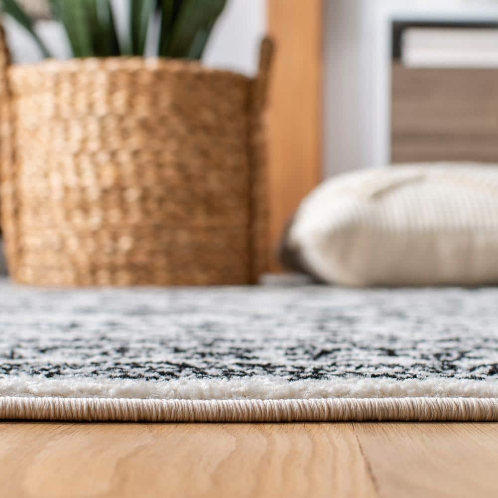 8' x 10' Black and Ivory Geometric Synthetic Area Rug