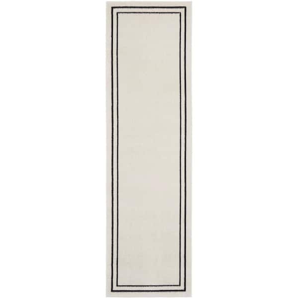 Nourison Essentials Ivory/Black 2 ft. x 6 ft. Solid Contemporary Runner Area Rug