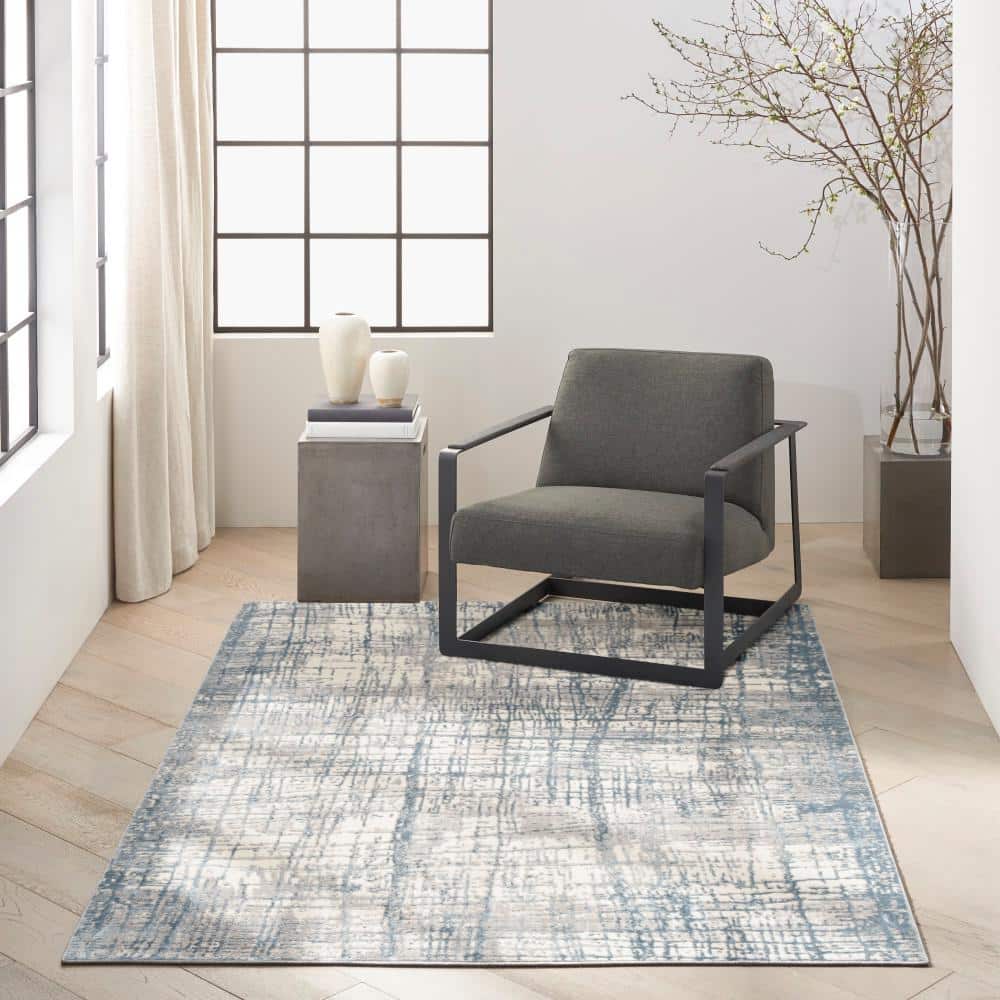 Ivory Blue Abstract 5' x 7' Synthetic Area Rug