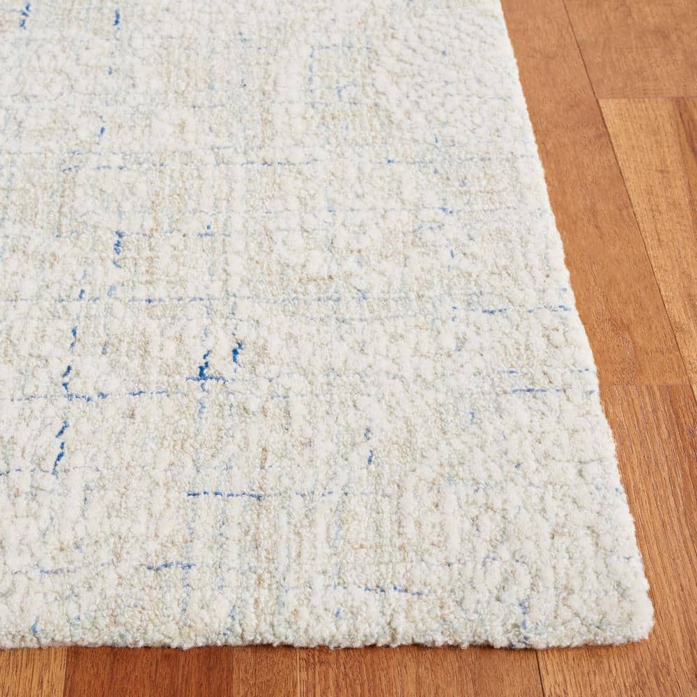 Handmade Blue and Ivory Wool Tufted 8' x 10' Rug