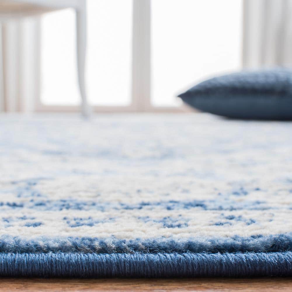 Ivory and Navy 8' x 10' Synthetic Washable Reversible Area Rug