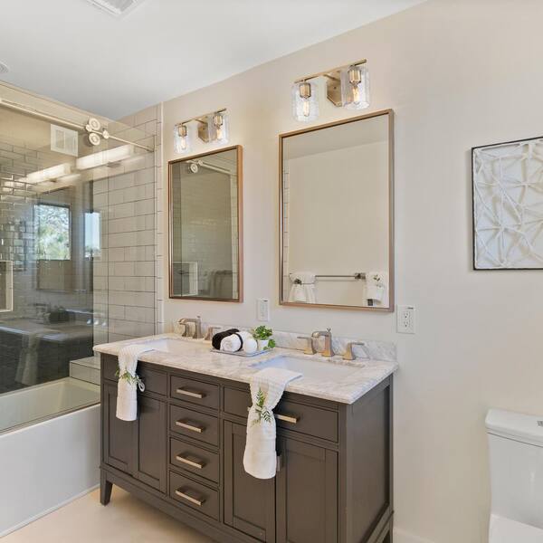 Designers Fountain - Haven 16 in. 2-Light Old Satin Brass Classic Vanity Light with Clear Rippled Glass Shades