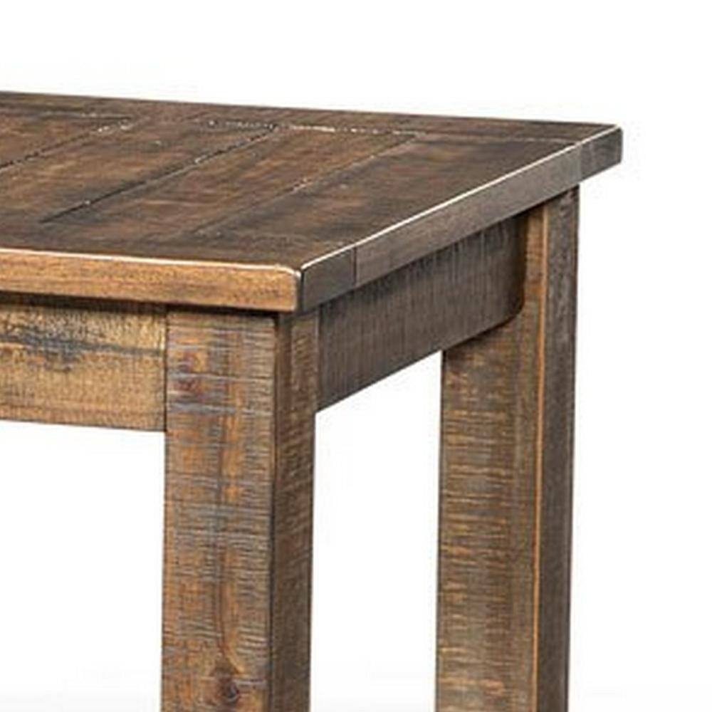 Close-up of the corner and wood grain of a brown end table.