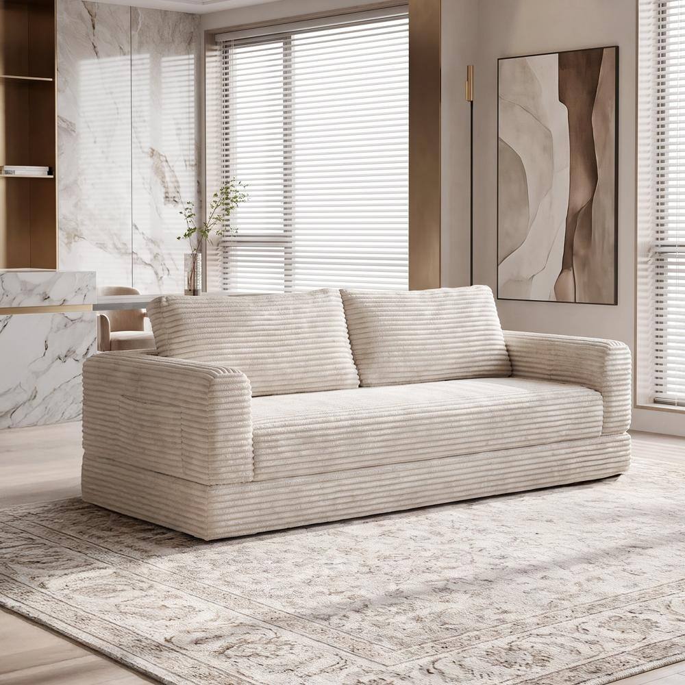Beige white corduroy sofa bed in a modern room.