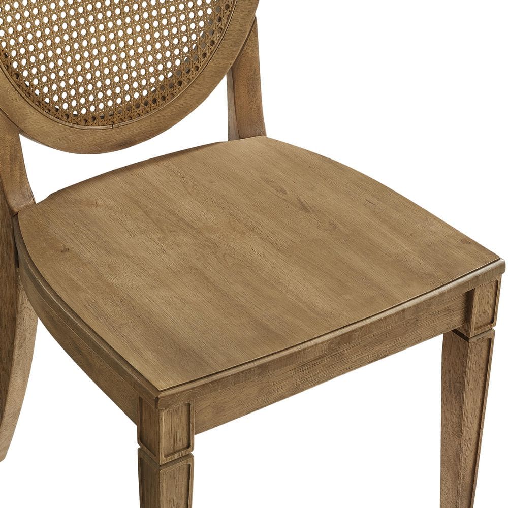Close-up of the wooden seat and frame of a Katia dining chair.