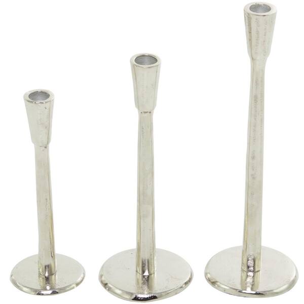 https://images.thdstatic.com/productImages/b9f8de81-5345-5312-9a9f-26788a78d5b4/svn/silver-litton-lane-candle-holders-043298-66_600.jpg