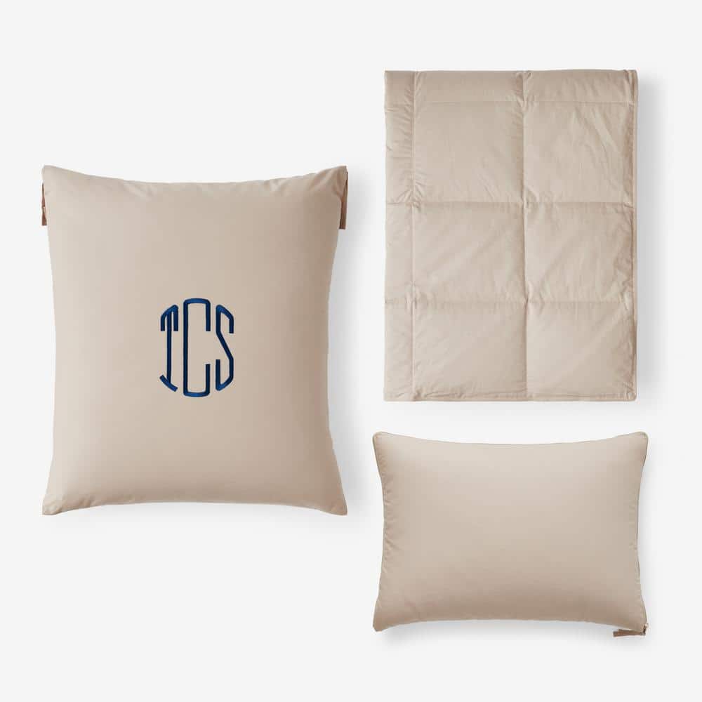 https://images.thdstatic.com/productImages/ba15084e-c50c-44e9-bd06-3f57261581ee/svn/tan-the-company-store-travel-pillows-11147h-os-fthr-tan-64_1000.jpg