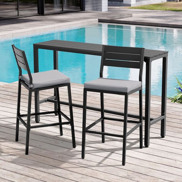 3-Piece Metal Bar Set Outdoor Bistro Set Bar Table with Footrest and Wood-Plastic Top 2-Stools with Cushions in Gray