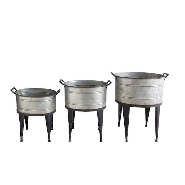 Storied Home Distressed Silver and Black Finish Metal Floor Planters with 4-Leg STands and Handles (3-Pack)