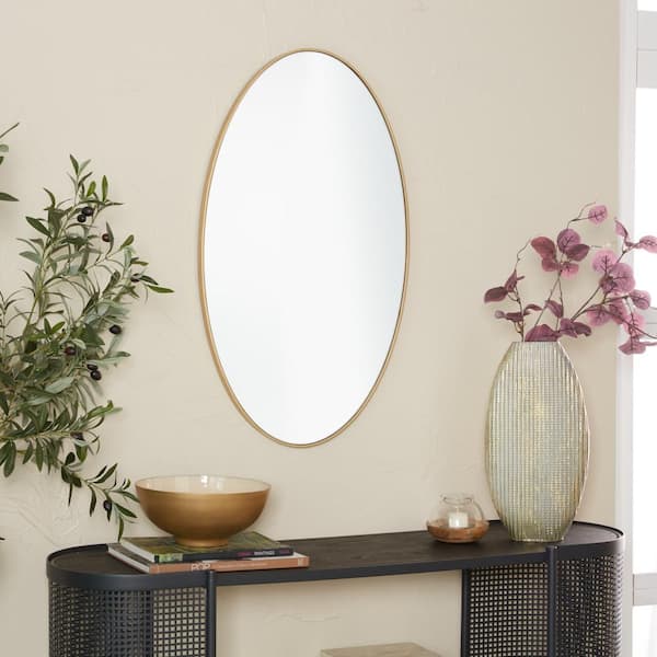 Litton Lane 32 in. x 18 in. Oval Round Framed Gold Wall Mirror with Thin Minimalistic Frame