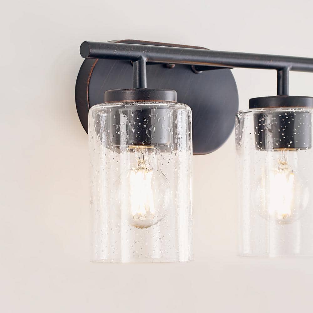 Oslo Bronze 2-Light Vanity Fixture with Clear Seeded Glass