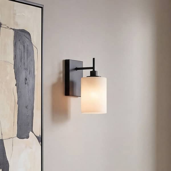 Meridian 4.75 in. W x 9.75 in. H 1-Light Matte Black Modern Wall Sconce with Strie Glass Shade