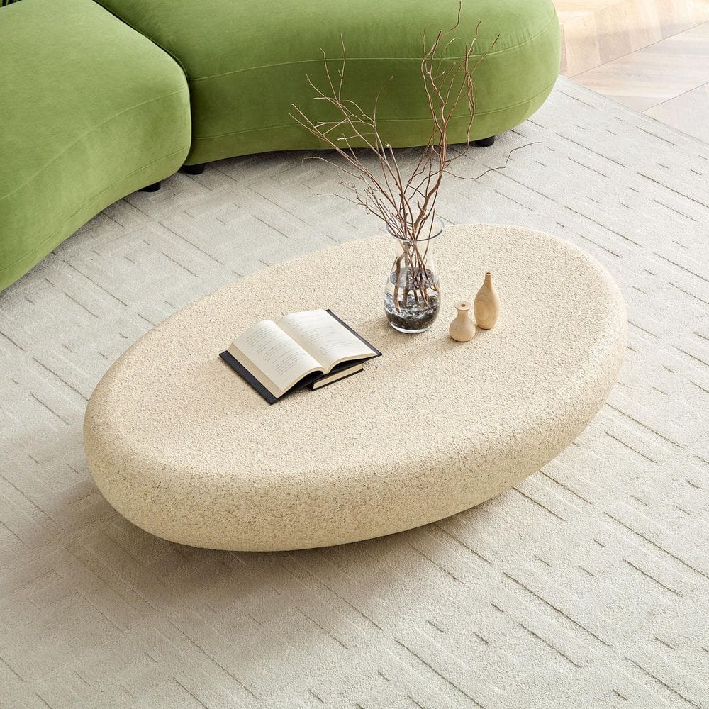 53.35 in. Light Yellow Oval Fiber Glass Elliptical Coffee Table, Matte Rocks Table front of the Sofa