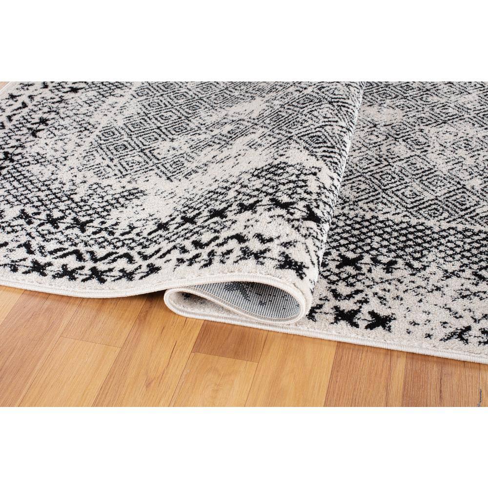 Black Geometric 5' x 7' Synthetic Easy Care Area Rug