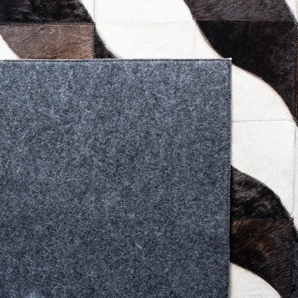 Handmade Black Geometric Cowhide Area Rug