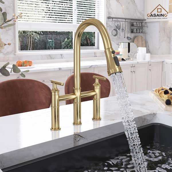Double Handle Bridge Kitchen Faucet with Three Function Pull-Down Sprayhead in Brushed Gold