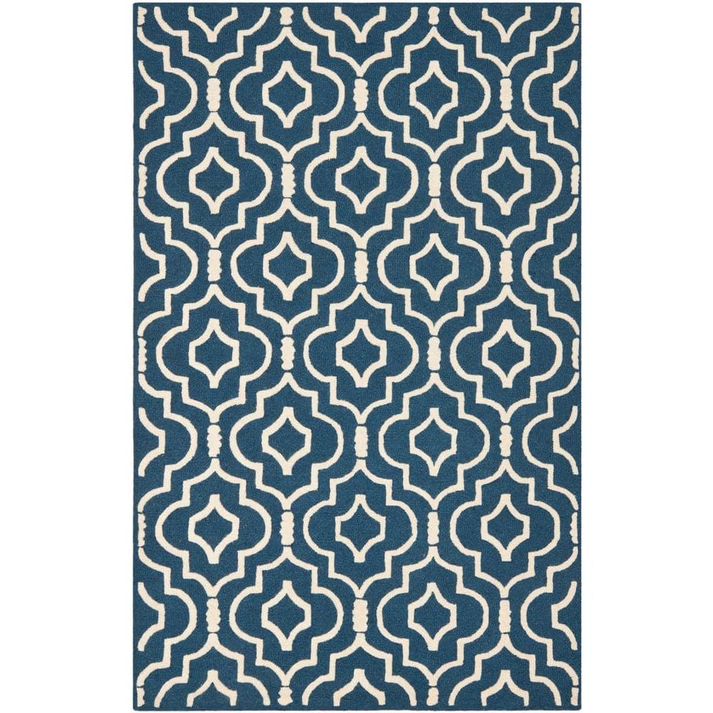 https://images.thdstatic.com/productImages/bb41240c-ac6b-44db-a28d-0f8814348a3e/svn/navy-blue-ivory-safavieh-area-rugs-cam141g-9-64_1000.jpg