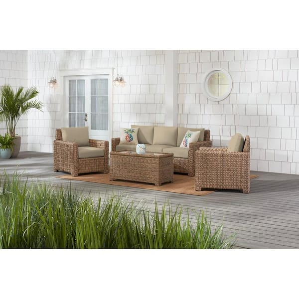 Hampton Bay Laguna Point 4-Piece Natural Tan Wicker Outdoor Patio Conversation Seating Set with CushionGuard Putty Tan Cushions