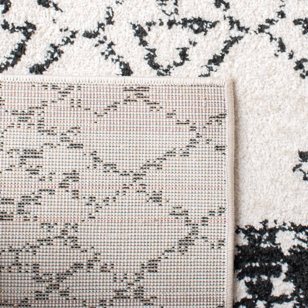 Ivory/Black Synthetic 6' x 9' Hand-Knotted Boho-Chic Area Rug