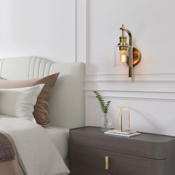 Alvra 1-Light Plated Natural Brass Hallway Bedroom Wall Sconce with Clear Glass Cylinder, Modern Vintage Vanity Light