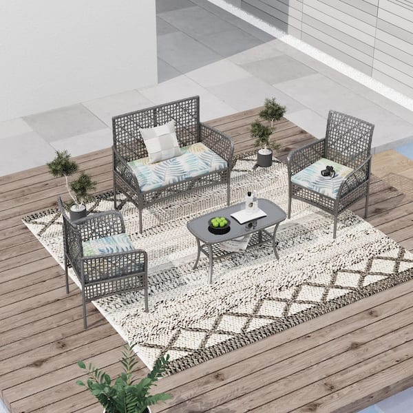Zeus & Ruta 4-Piece Wicker Patio Conversation Set with Multi-Colored Cushions and Coffee Table for Backyard