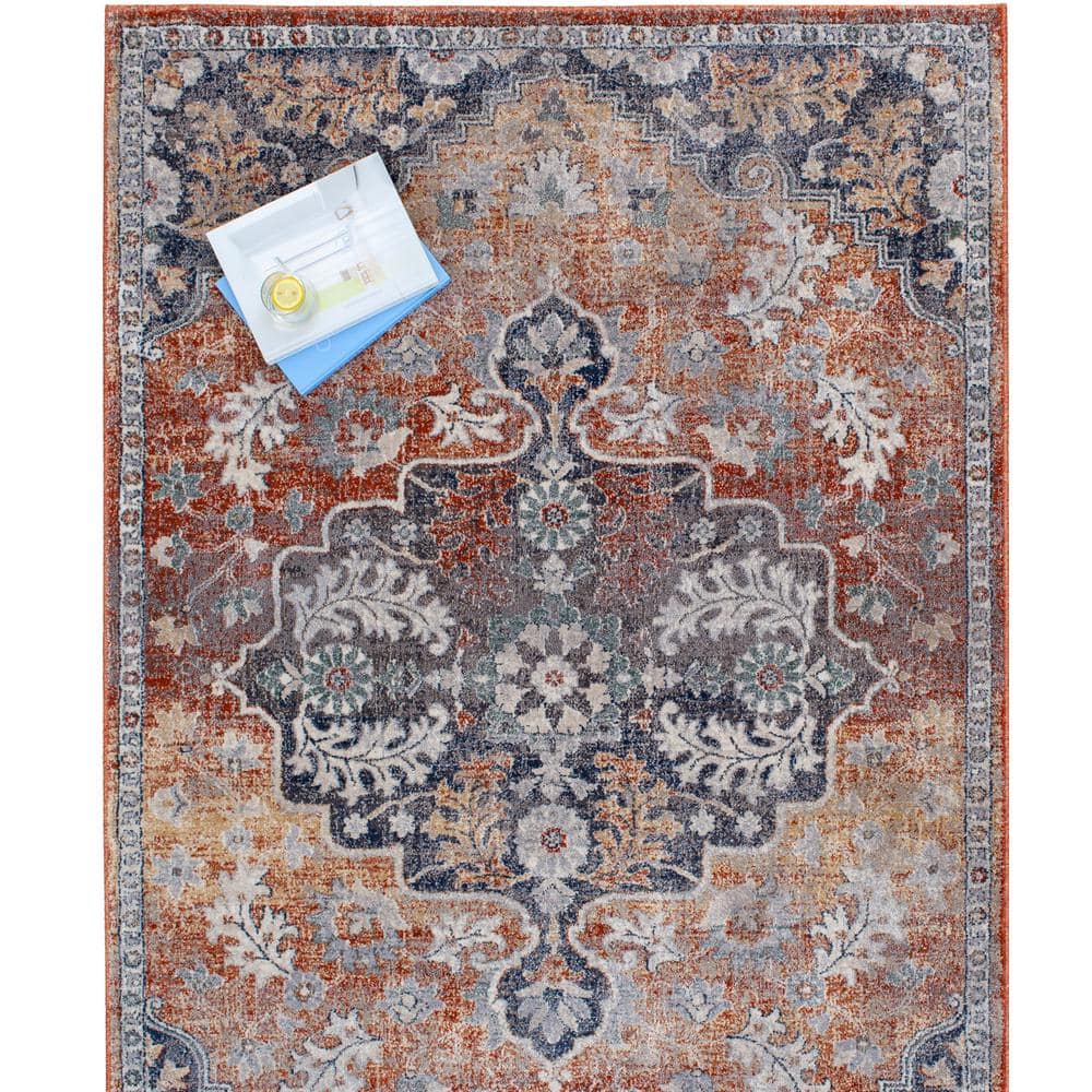 Blue and Taupe 2' x 3' Oriental Synthetic Area Rug