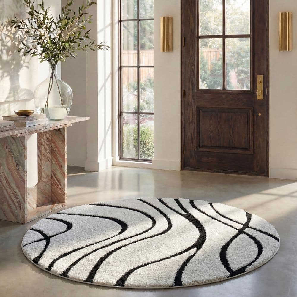 SAFAVIEH Florida 7 ft. x 7 ft. Ivory/Black Abstract Round Rug
