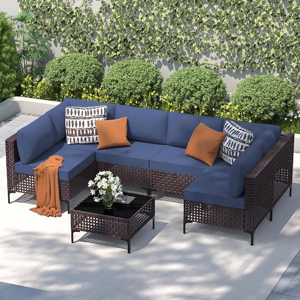 Halmuz 7-Piece Brown Wicker Outdoor Furniture Sectional Set, with Glass Coffee Table and Navy Cushions
