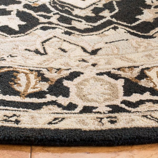 https://images.thdstatic.com/productImages/bc839e54-4277-4bea-a222-0dd9c0bb7788/svn/black-natural-safavieh-area-rugs-hk709f-8r-31_600.jpg