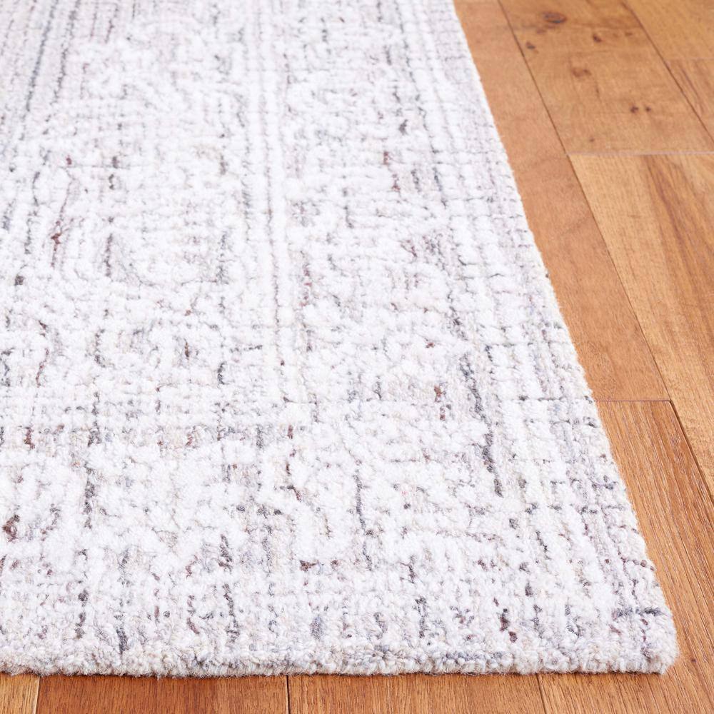 Ebony 6' x 9' Brown and Ivory Wool Tufted Area Rug