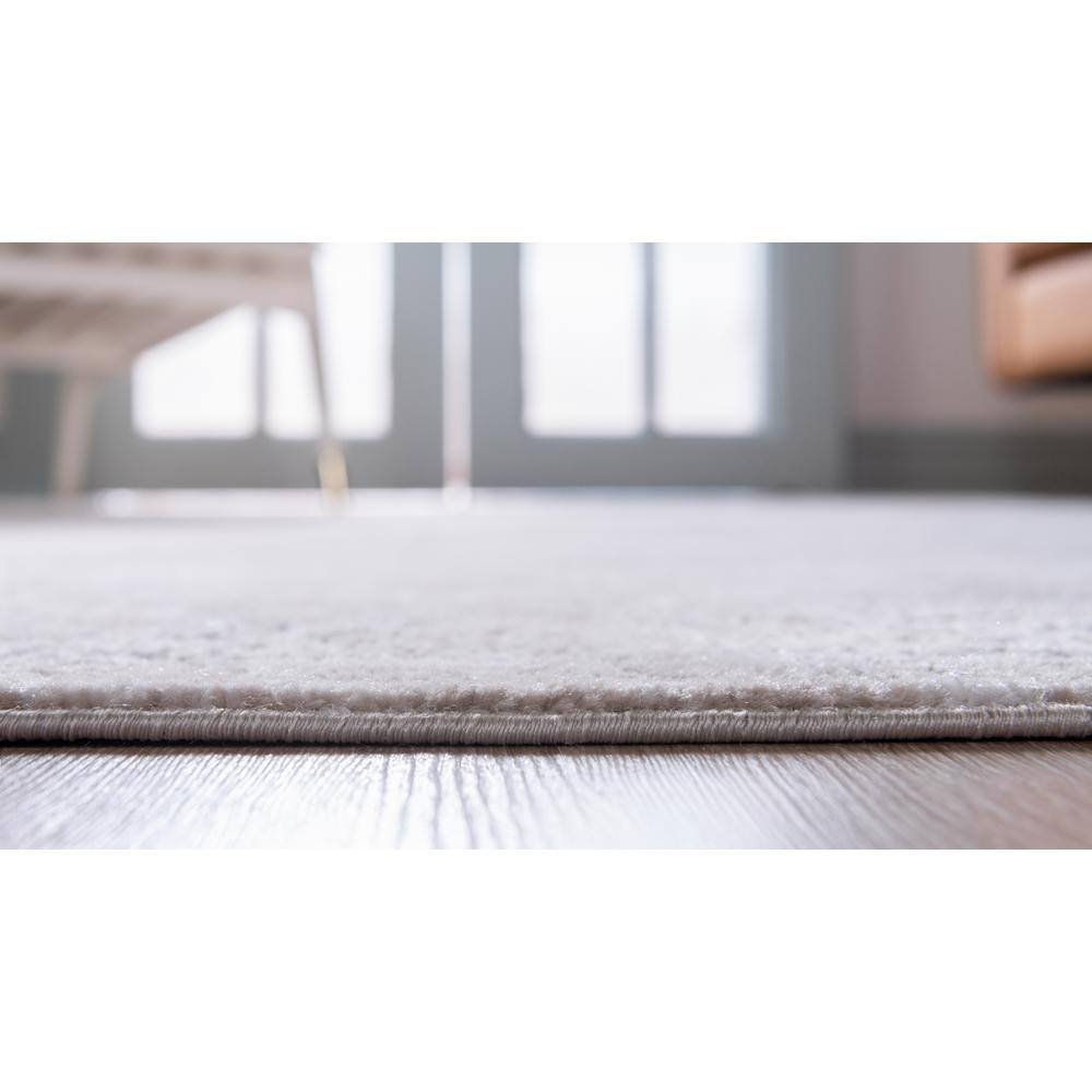 Ivory and Gray Geometric Synthetic 6' x 9' Area Rug