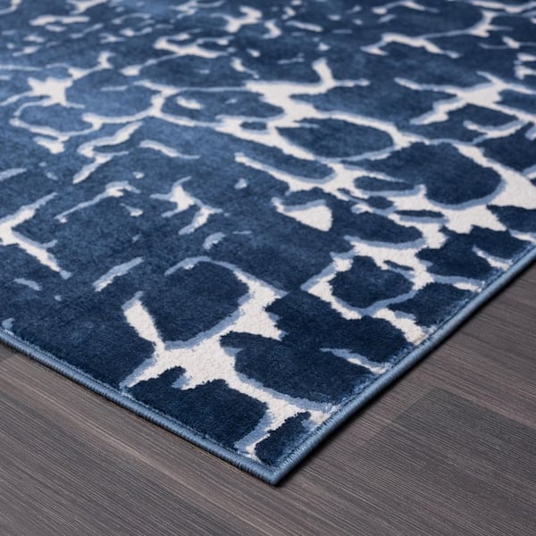 Regal Blue 5 ft. 3 in. x 7 ft. 6 in. Abstract Polypropylene Area Rug