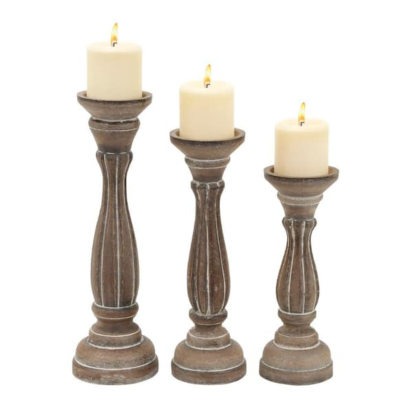 Benjara Distressed Brown Handmade Wooden Candle Holder with Pillar Base Support (Set of 3)
