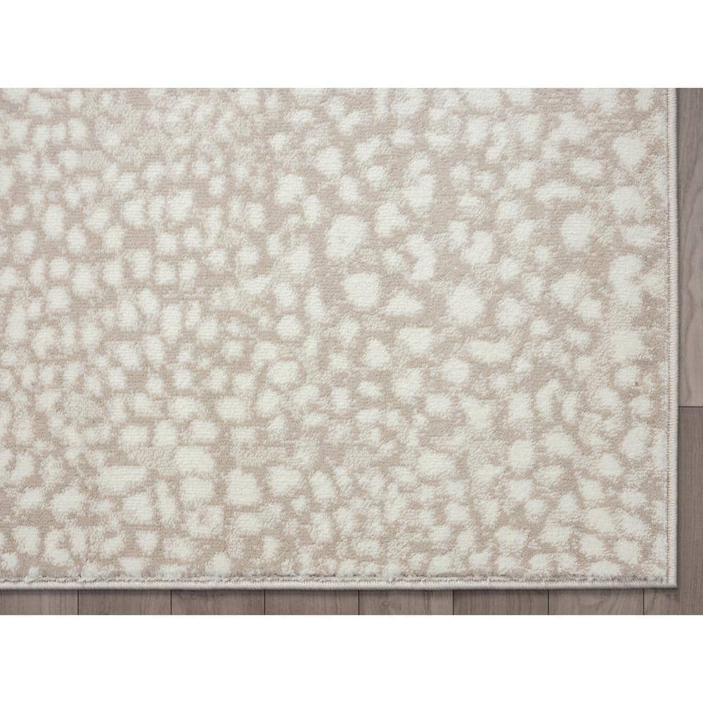 Ivory and Beige Cheetah Print 8' x 10' Synthetic Area Rug