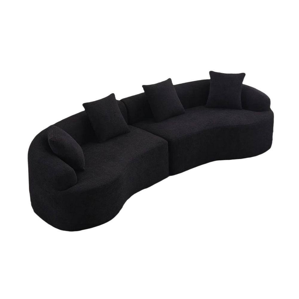 Black curved modular sectional sofa with four pillows.