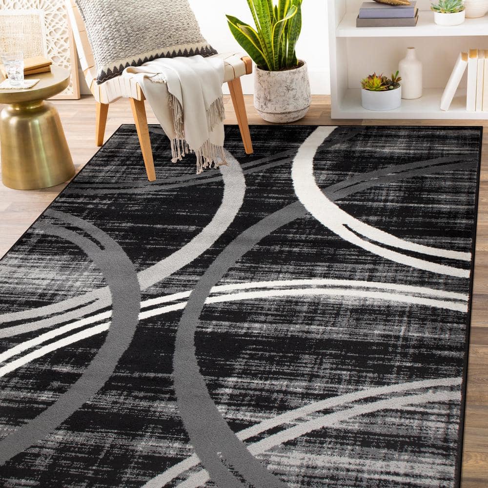 Modern Black and Gray Abstract Oval Area Rug, 5' x 7'