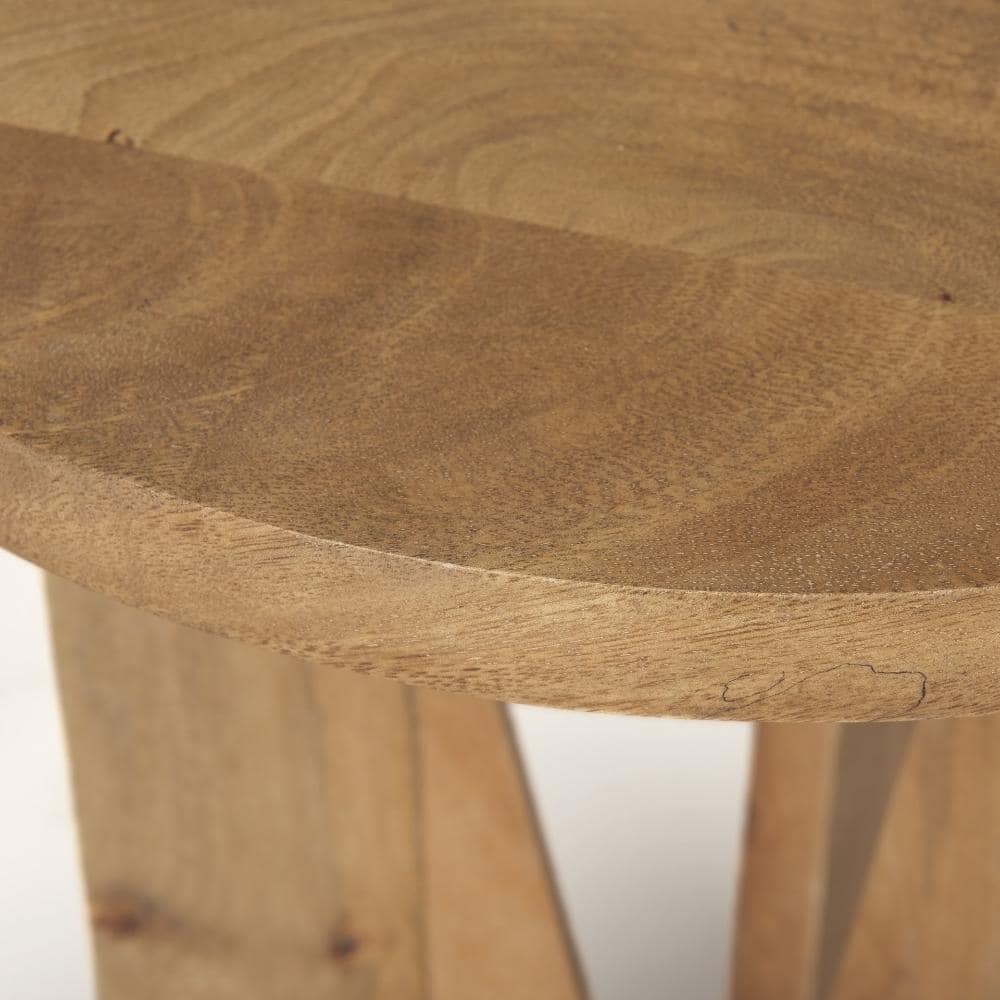 Close-up view of the round wooden tabletop surface.