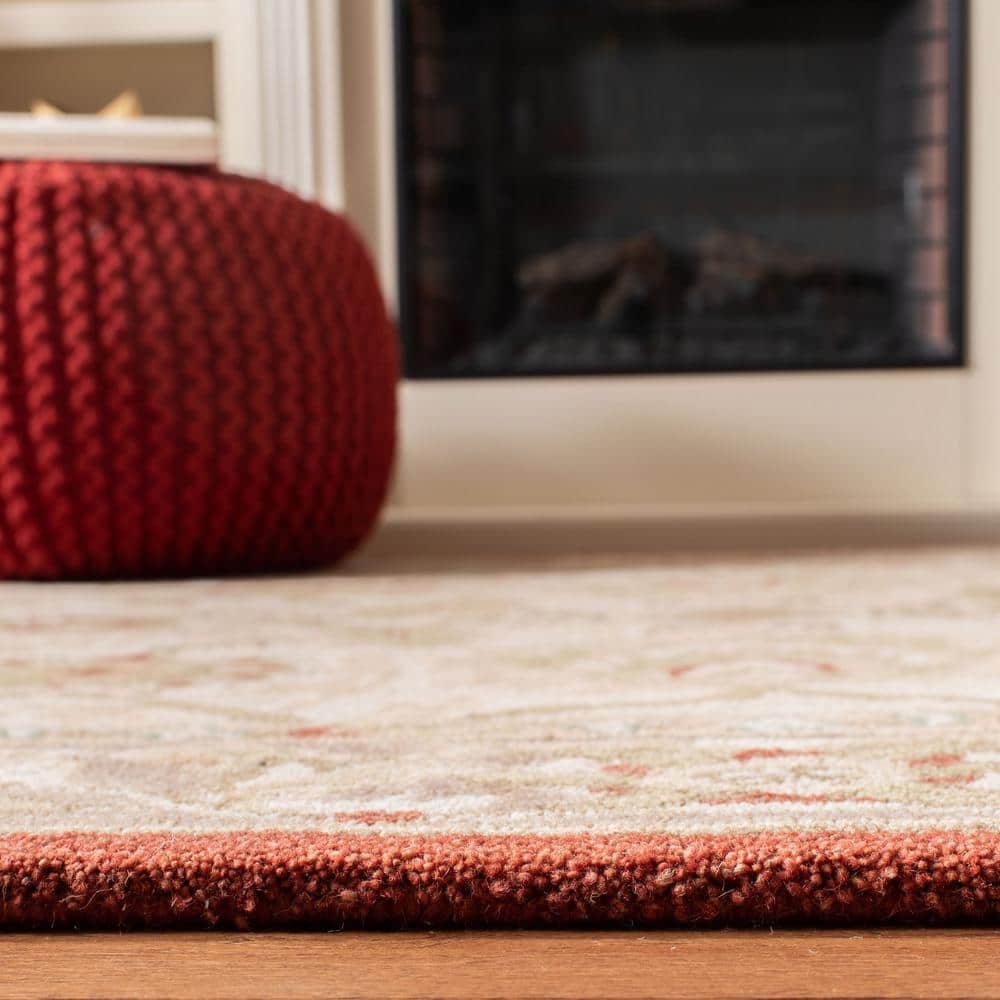 Handmade Beige and Rust Floral Wool Area Rug, 5' x 8'
