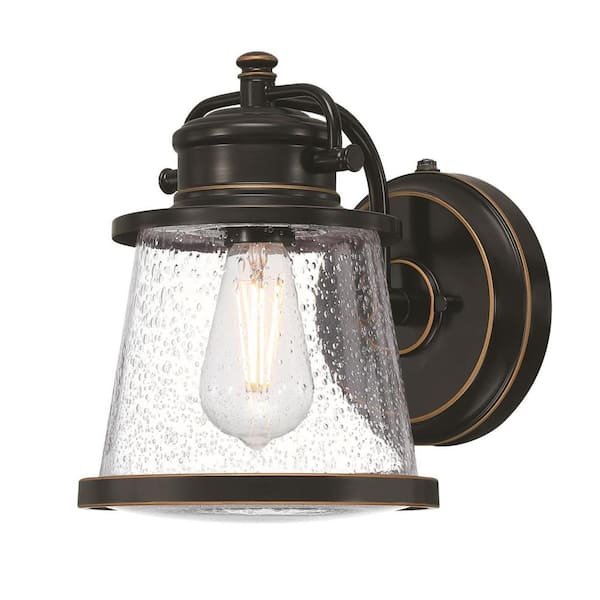 Westinghouse Emma Jane 1-Light Amber Bronze Outdoor Wall Mount Lantern with Clear Seeded Glass, Dusk to Dawn Sensor